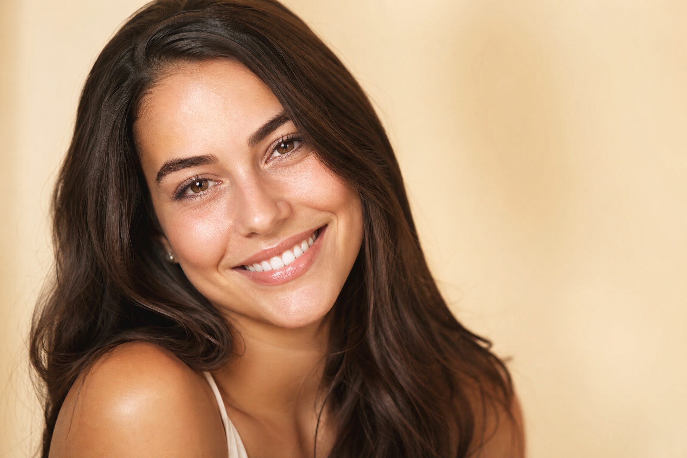 Happy patient with custom veneers at Carmel Family Dental Indianapolis